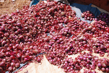 Sale of red onions at the market of the 