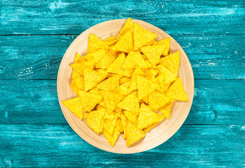 Plate of nachos with different dips
