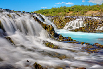 Fototapeta premium The amazing Bruarfoss waterfall with its turquoise water in Iceland