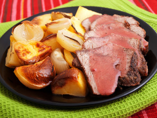 Roasted pork with baked potatos