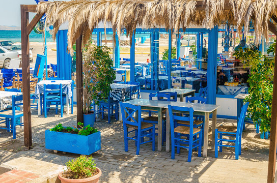 Romantic Greek restaurant with blue chairs, Greece