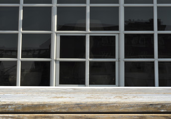 Wooden shelf and window - background