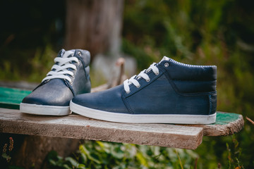 Men's shoes, sneakers on nature