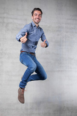thumps up jump of a happy business man