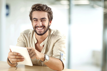 Young man using digital tablet