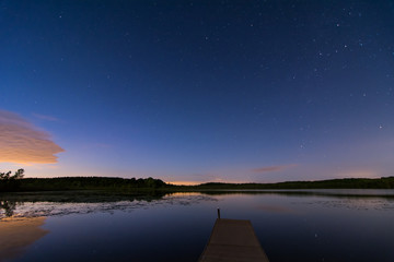 The starry night sky over a lake in Wisconsin.