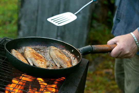 Fish Frying In Oil On The Fire