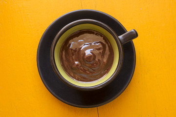 Decorative cup of artisan dark chocolate