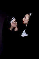Halloween. The girls are dressed in sexy evil nuns