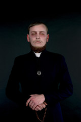 Halloween. A man dressed as the evil Catholic priest