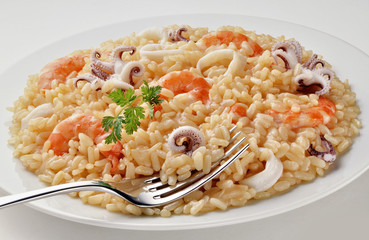 Dish of Seafood Risotto with Fork