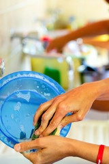 woman hands washing dishes