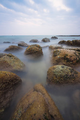 Rock in the sea and the soft waves