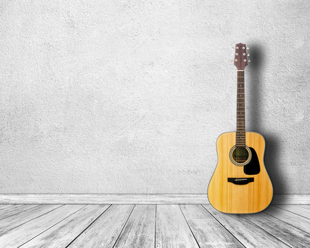 Guitar in white room.