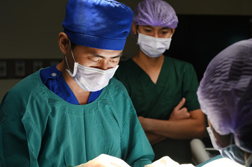 group of veterinarian surgery in operation room