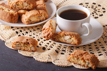 Black coffee and cookies with almonds close-up. Horizontal
