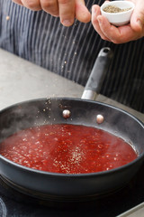 chef making sauce