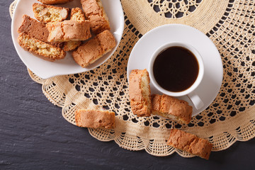 coffee and cookies cantuccini with almonds closeup. horizontal top view 
