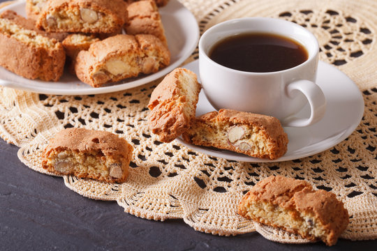 Black coffee and cookies with almonds close-up. Horizontal
