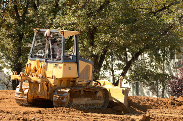 Bulldozer pushing out a new lift of dirt and rock for a new road.