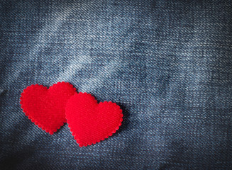Jeans background with red heart