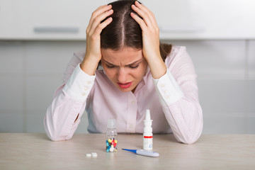 Pretty woman with a bottle of pills