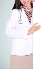 A smiling female doctor with a blank board, isolated on green background