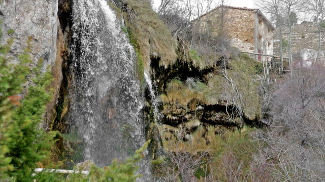 Natural   waterfall at river  in winter. Cuenca, Spain
