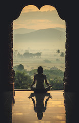Silhouette of a beautiful Yoga woman in the morning - vintage st