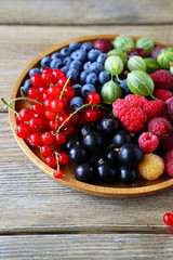 ripe and fresh summer berries on plate