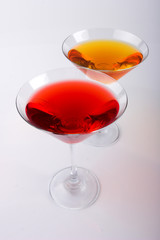 two various glasses of martini isolated on a white background