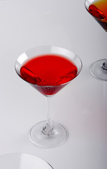 two various glasses of martini isolated on a white background