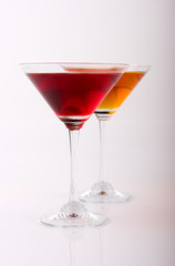 two various glasses of martini isolated on a white background