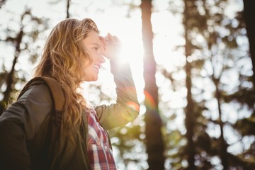 Pretty blonde hiker looking for path 