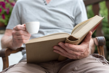 Man reading a book outdoor