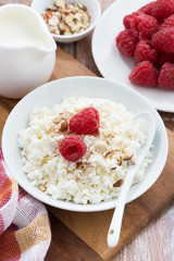 cottage cheese with fresh raspberry, vertical