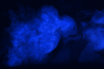 powder cloud against dark background