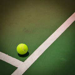 tennis ball on green court