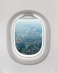 Looking out the window of a plane to the city of Prague