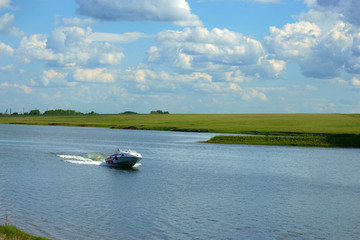 man on a boat floating on the lake