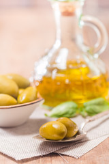 Olive oil and olives in bowl