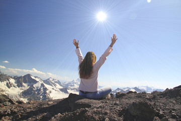 Winning success woman happy with her hands raised above the head