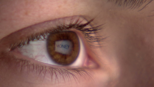 Eye watching the screen with reflection of the word 