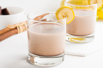 Glass of chocolate milkshake on the table