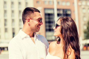 smiling couple in city
