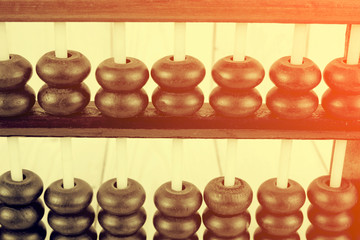 Vintage style - Close up of a wooden abacus beads. Selective foc