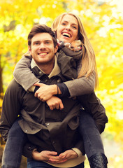 Fototapeta premium smiling friends having fun in autumn park