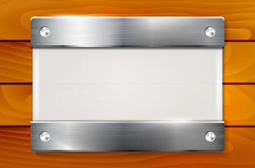 Plexiglass plate with metal holders on wooden background