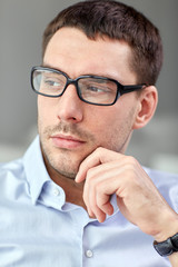 portrait of  businessman in eyeglasses at office