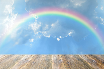 Wood terrace and sky with rainbow